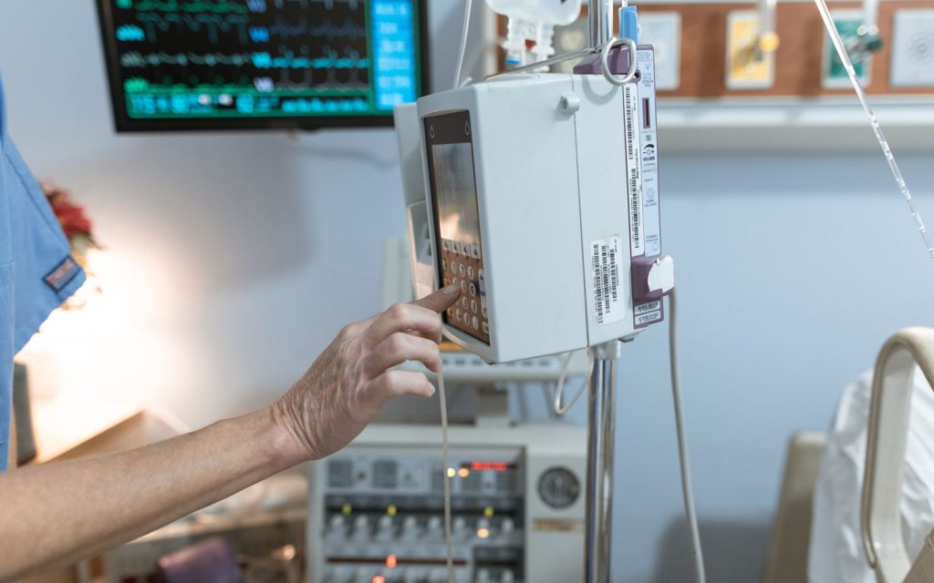 Clinician operating an infusion pump