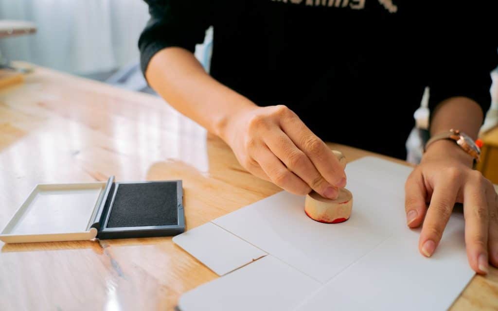Hand stamping an official document