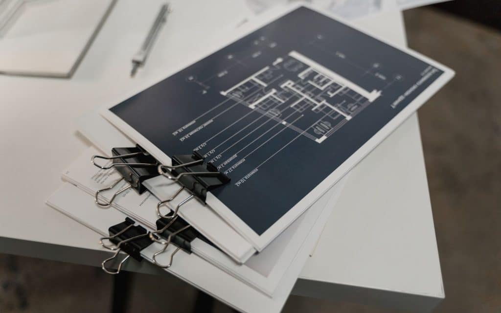 Pile of documents on a white table