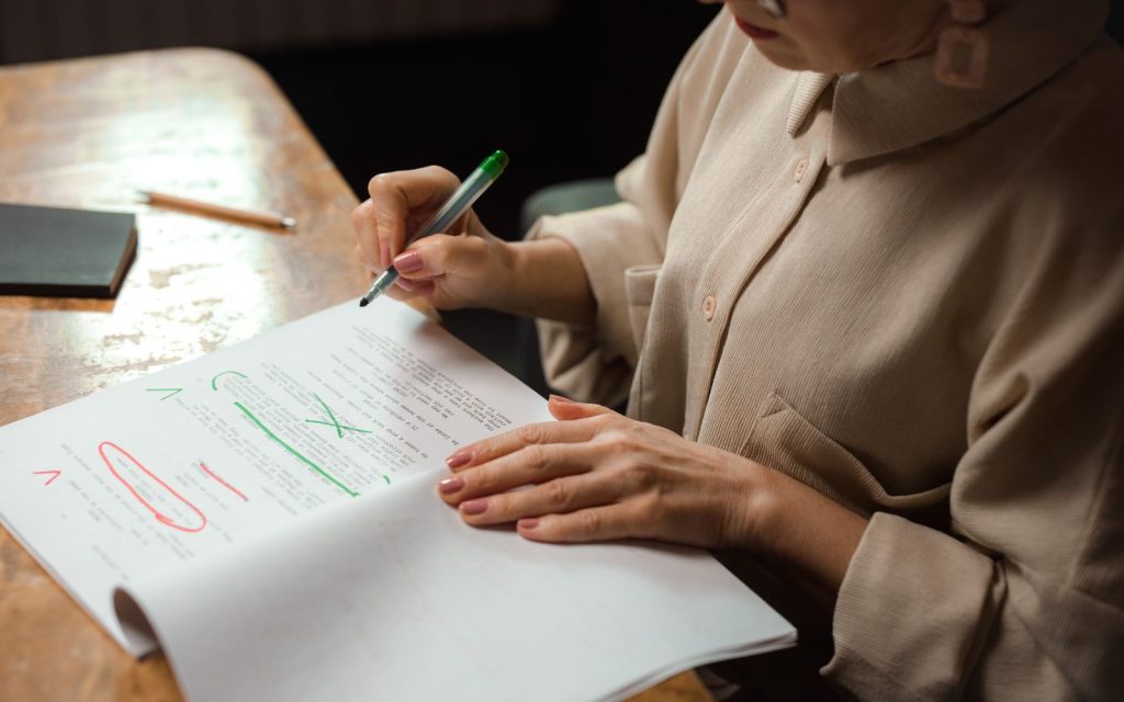 Proofreader reviewing a printed text