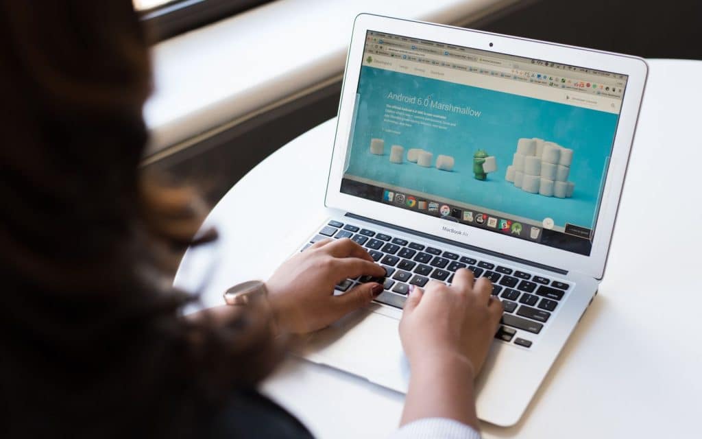 Woman working on a laptop at a table