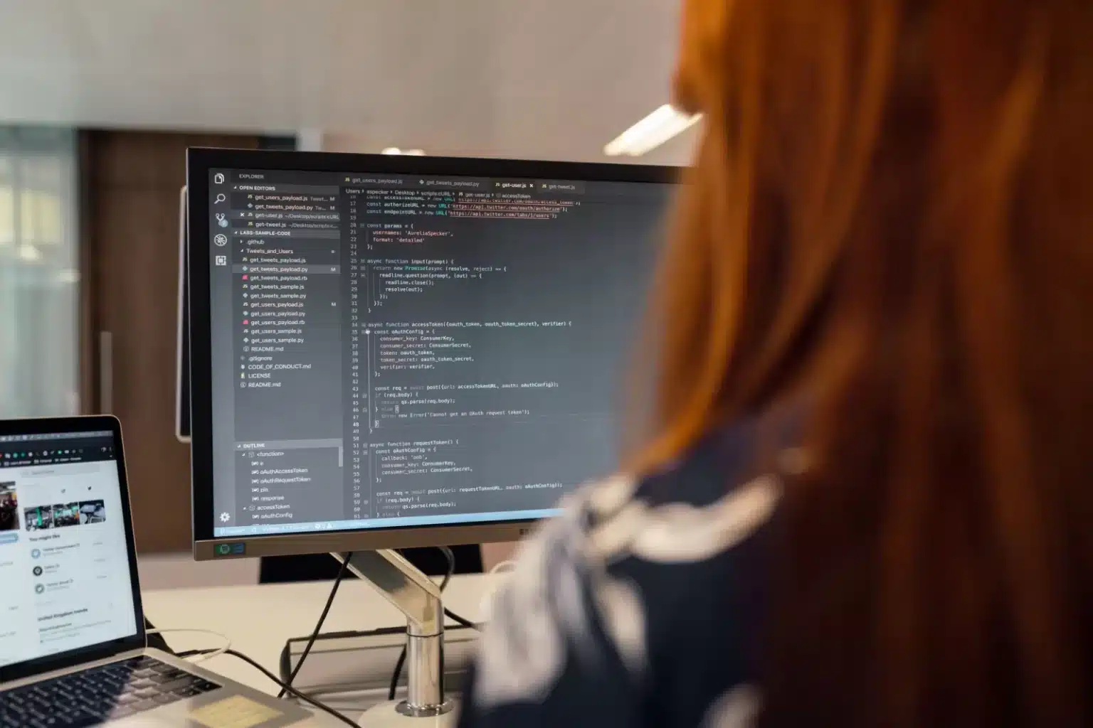 Software engineer working on code in an office